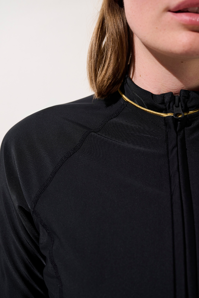 Veste de bain anti-UV - Malta en lycra noir pour femme, idéale pour la baignade et la protection solaire.