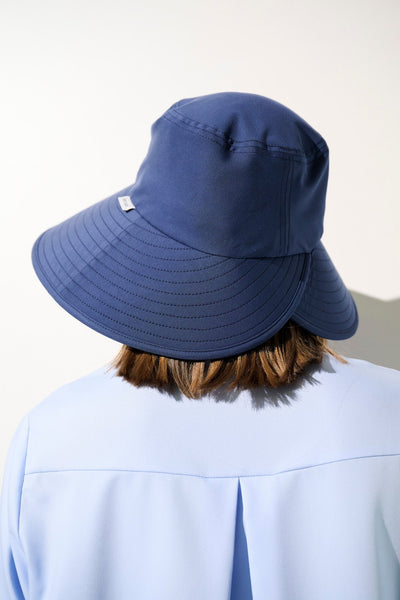 Chapeau anti-UV - Capri bleu marine, élégant et léger, offrant protection UPF 50+ pour femme.