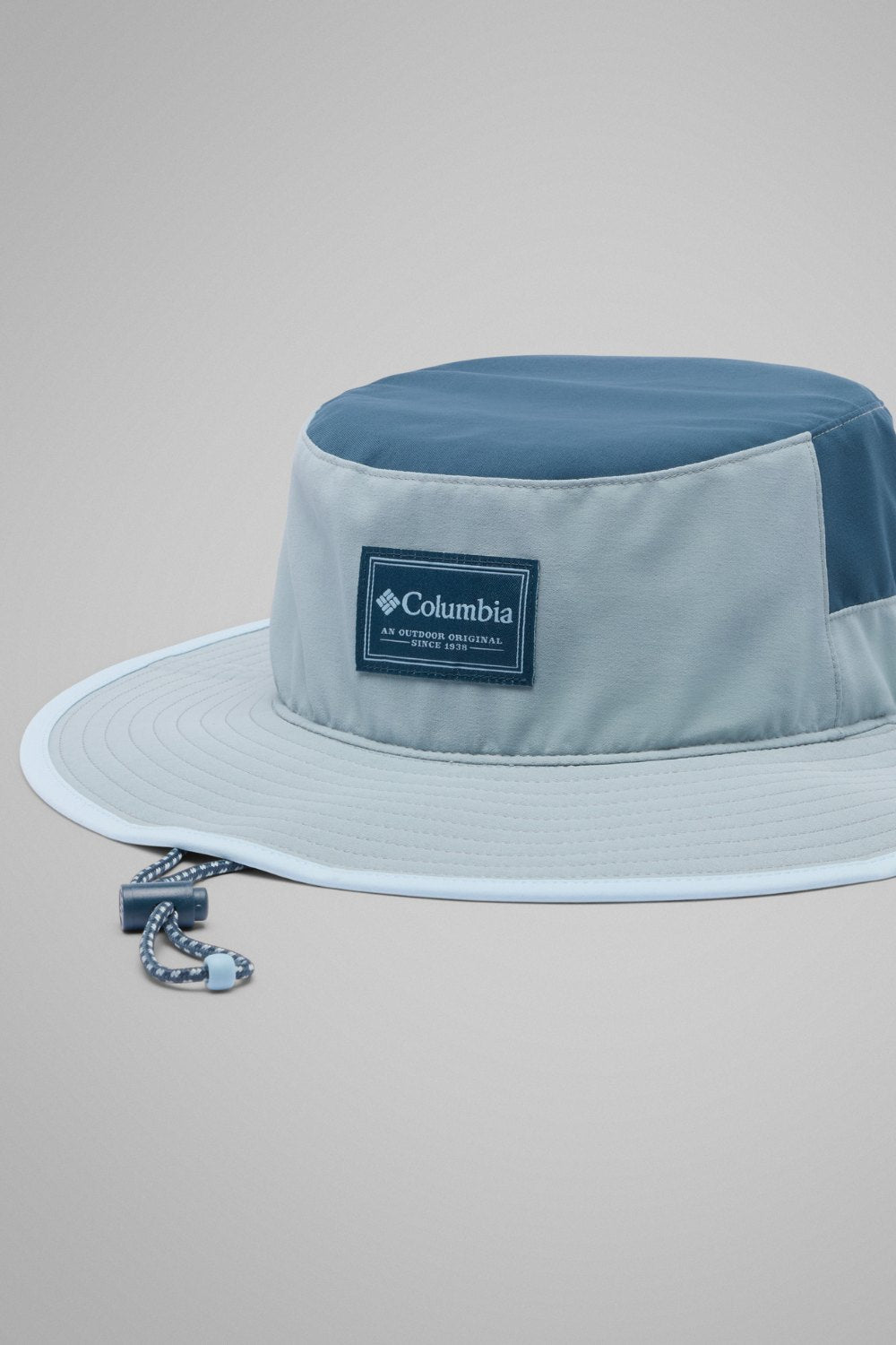 Chapeau anti-UV Broad Spectrum II Booney en gris et bleu, léger, avec protection UPF 50+ pour femme, idéal pour le soleil.