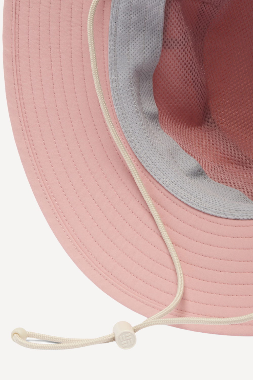 Chapeau anti-UV rose Columbia, avec protection UPF 50+, idéal pour les activités en extérieur sous le soleil.