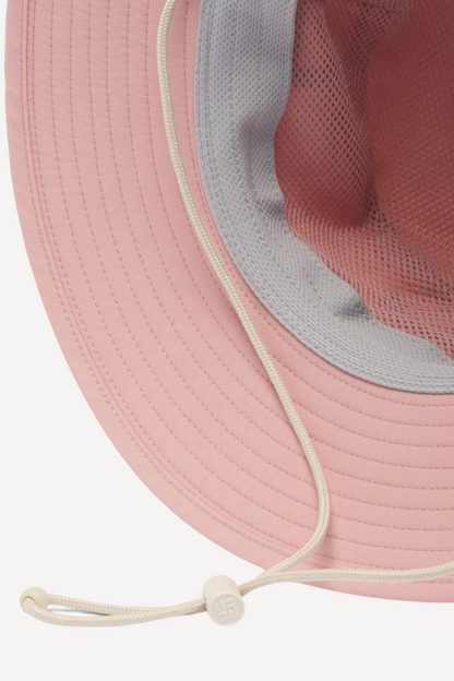 Chapeau anti-UV rose Columbia, avec protection UPF 50+, idéal pour les activités en extérieur sous le soleil.
